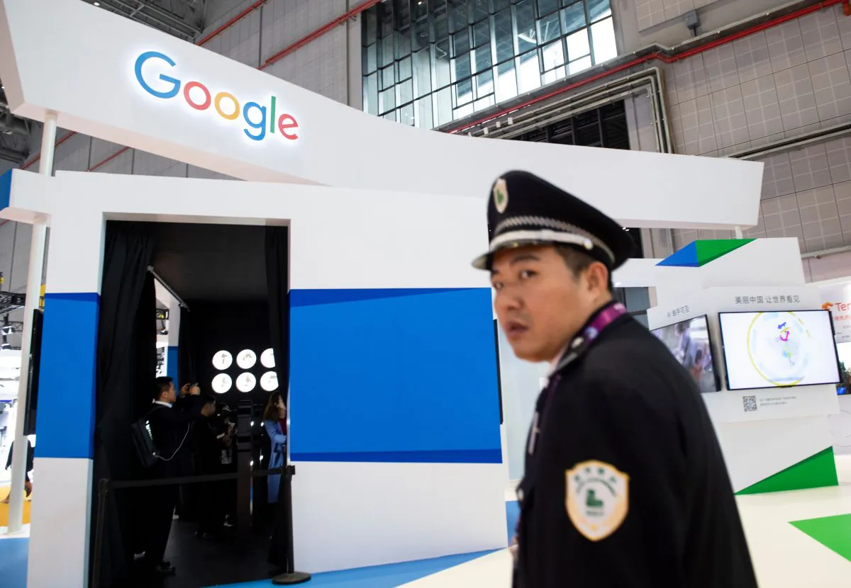 A security guard passing a booth of Google at the first China International Import Expo in Shanghai on Nov. 5, 2018. (JOHANNES EISELE/AFP/Getty Images)