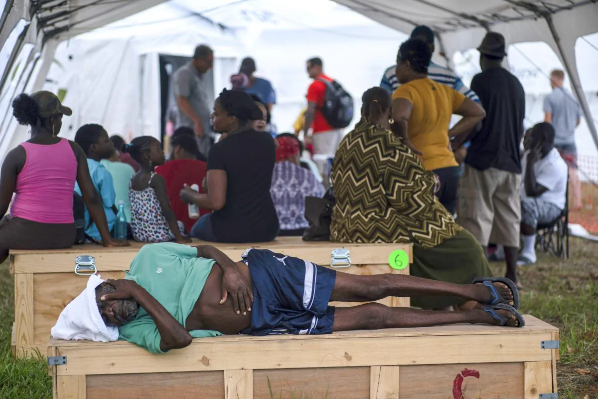 An man rests at a tent-hospital set up by Samaritan's Purse in the aftermath of Hurricane Dorian in Freeport, Bahamas, on Sept. 10, 2019. (Ramon Espinosa/AP)