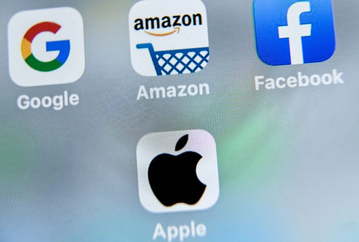 A picture taken on Aug. 28, 2019 shows the apps of Google, Amazon, Facebook and Apple. (DENIS CHARLET/AFP/Getty Images)