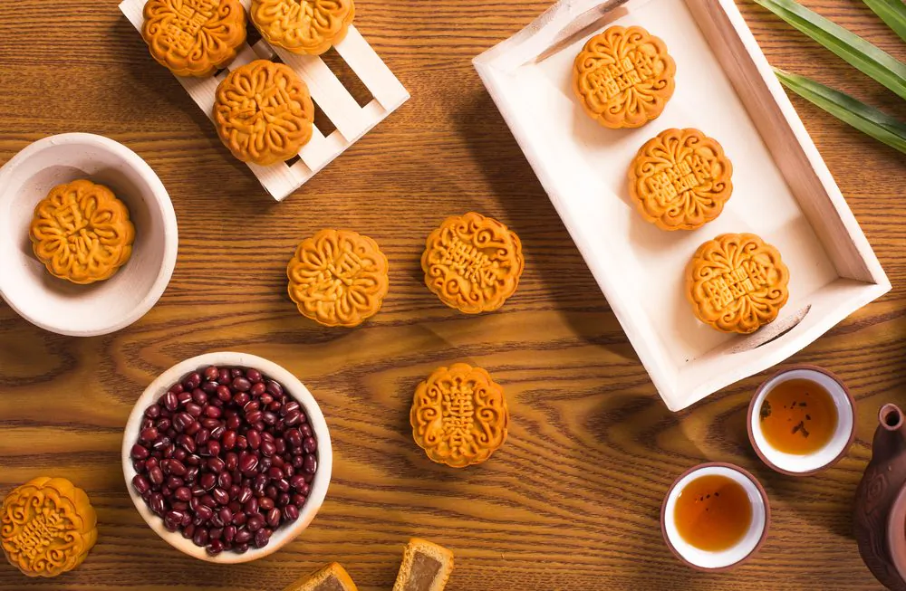 Traditional mooncakes, served with tea. (Shutterstock)