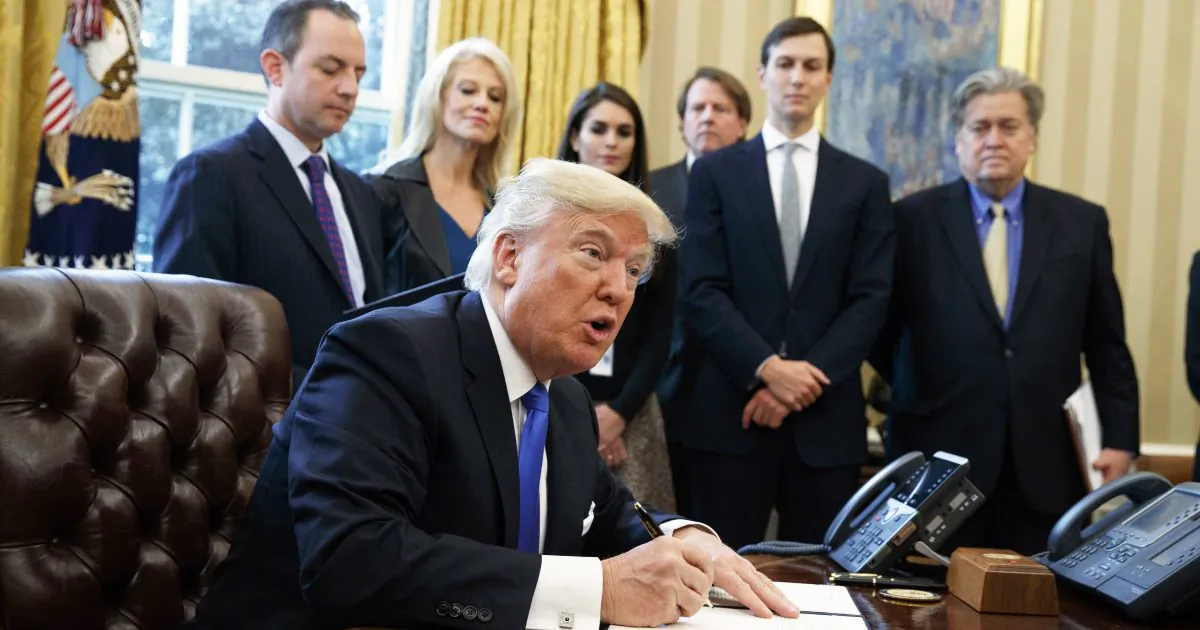 President Donald Trump signs an executive order on the Keystone XL pipeline in the Oval Office of the White House. Native American tribes in Montana and South Dakota say the Trump administration unlawfully approved the oil pipeline without considering potential damage to cultural sites. (Evan Vucci/AP)