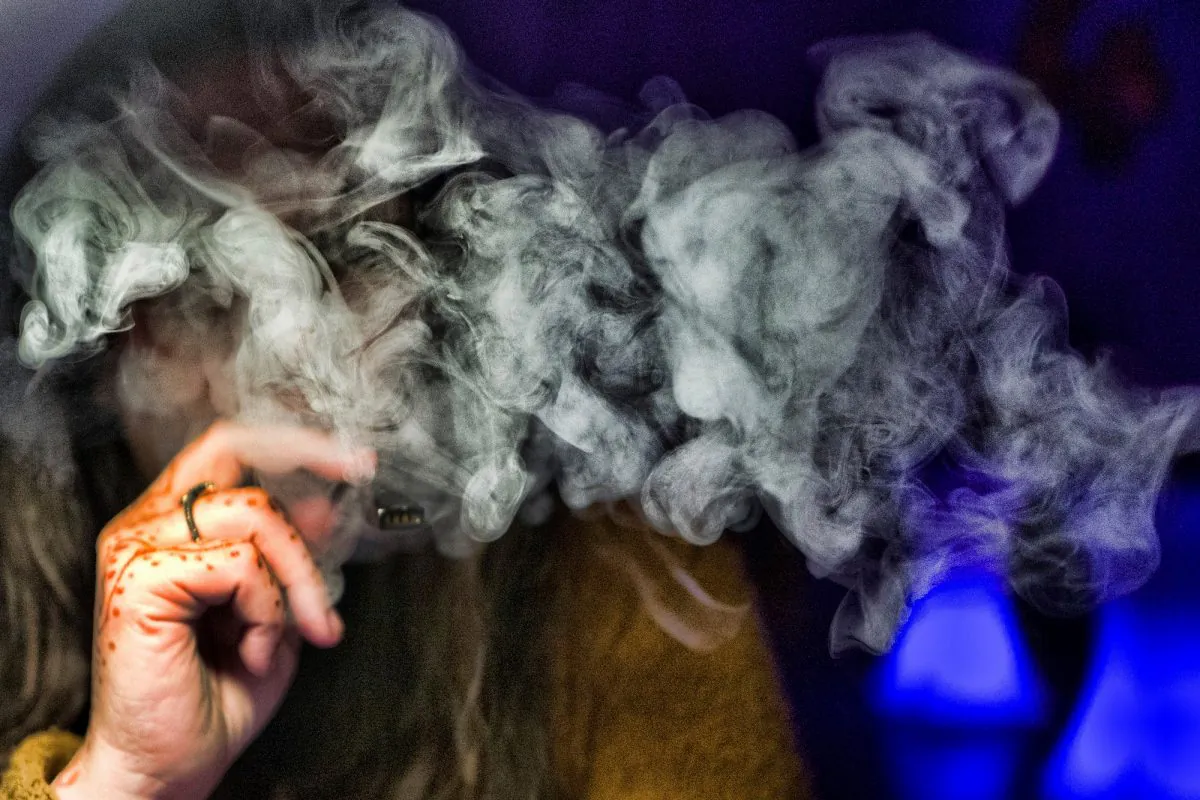 A woman vapes in a file photograph. (Richard Vogel/AP Photo)