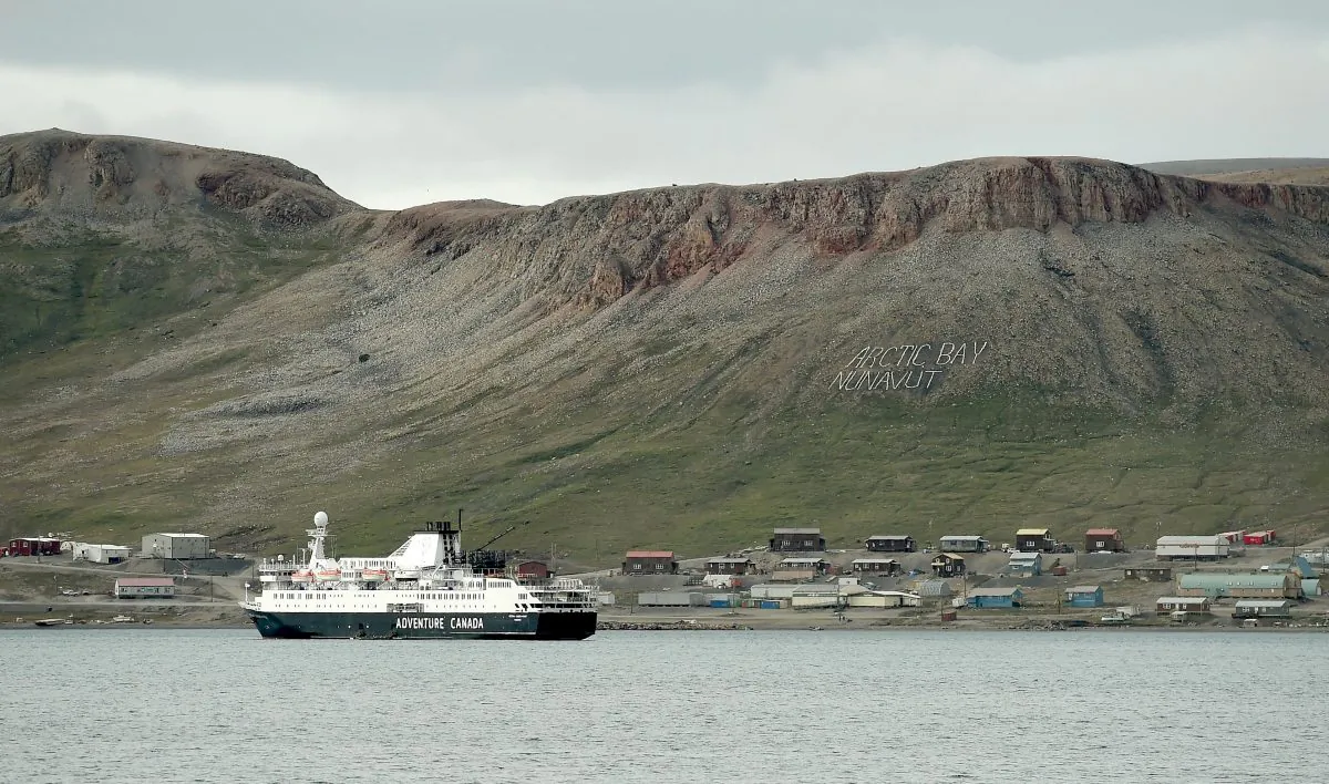 A ship is docked at the community of Arctic Bay, Nunavut, on Aug. 1, 2019. (THE CANADIAN PRESS/Sean Kilpatrick)