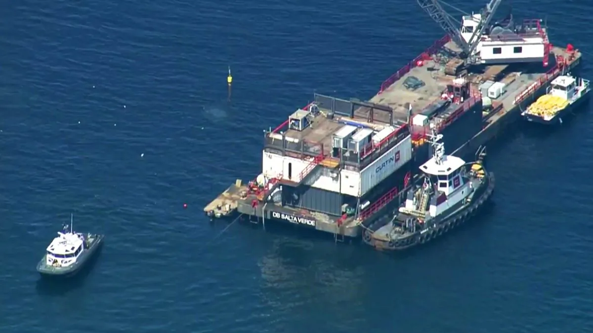 This photo from video provided by KABC-TV shows divers resuming their search for the final missing victim who perished in a boat fire off the Southern California coast on Sept. 11, 2019. (KABC-TV via AP)