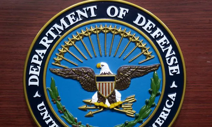 The U.S. Department of Defense seal is seen on the lectern in the media briefing room at the Pentagon in Washington, D.C., on Dec. 12, 2013. (Paul J. Richards/AFP/Getty Images)