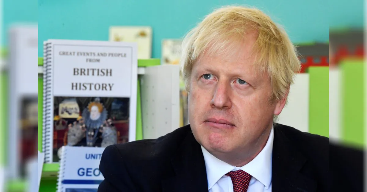 Britain's Prime Minister Boris Johnson speaks with year four and year six pupils during a visit to Pimlico Primary school on Sept. 10, 2019 in London, England. (Toby Melville/WPA Pool/Getty Images)