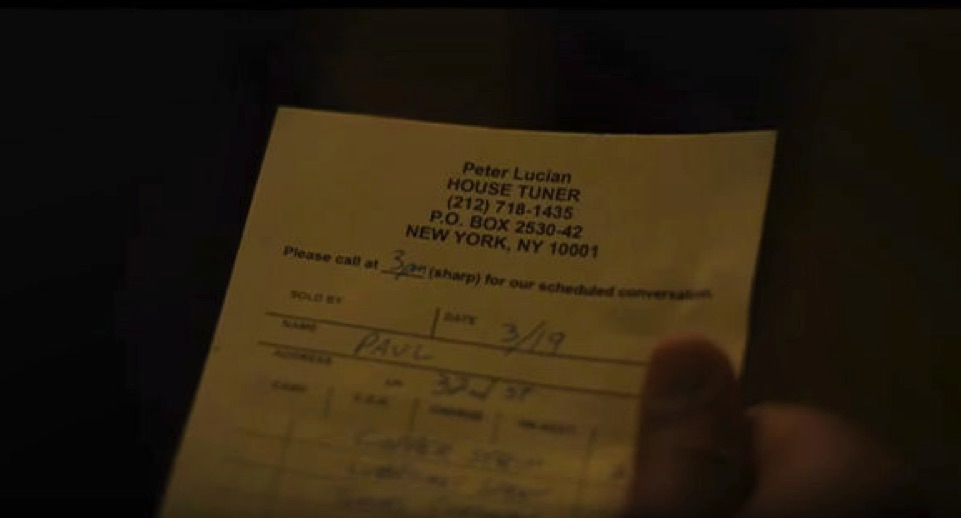 hand holding piece of paper