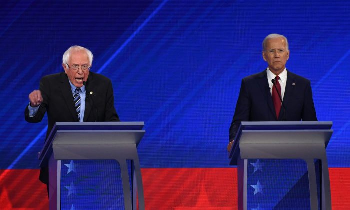 Democratic presidential hopefuls Sen. Bernie Sanders (I-Vt.), left, and former vice president Joe Biden during the third Democratic primary debate in Houston, Texas on Sept. 12, 2019. (Robyn Beck/AFP/Getty Images)