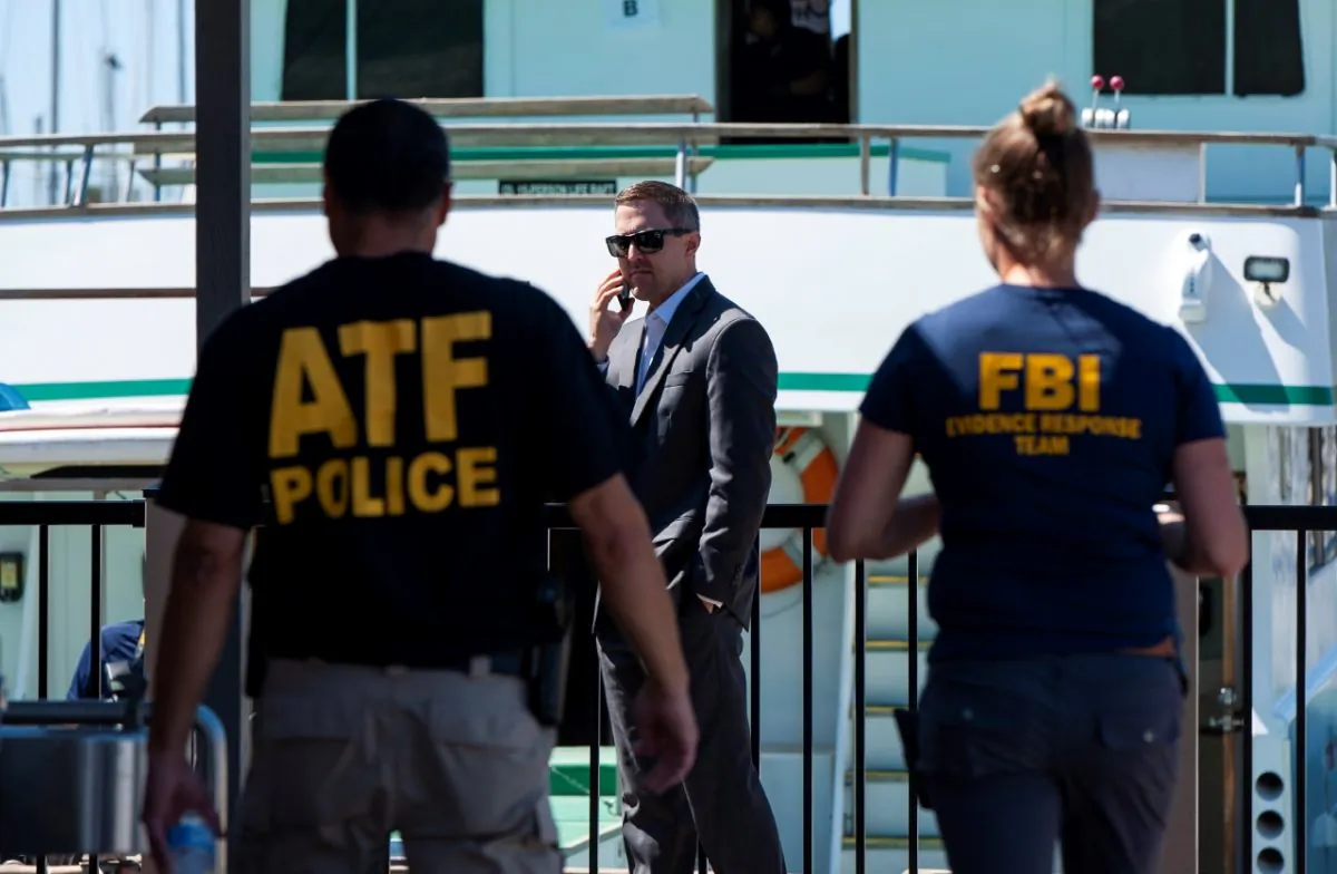 Investigators check the Truth Aquatics office on the Santa Barbara Harbor in Santa Barbara, Calif., on Sept. 8, 2019. (Christian Monterrosa/AP Photo)