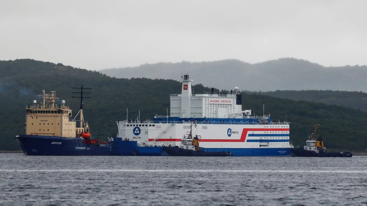 Russia's floating nuclear power plant Akademik Lomonosov and tugboat Dixon before the departure from the service base of Rosatomflot company for a journey along the Northern Sea Route to Chukotka in Murmansk, Russia, on Aug. 23, 2019. (Maxim Shemetov/Reuters)