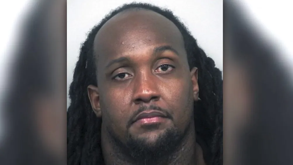 This undated photo provided by the Gwinnett County (Ga.) Police Department shows Edawn Louis Coughman, who police say trashed his restaurant and ice cream shop near Atlanta to fake a racially motivated burglary. (Gwinnett County Police via AP)