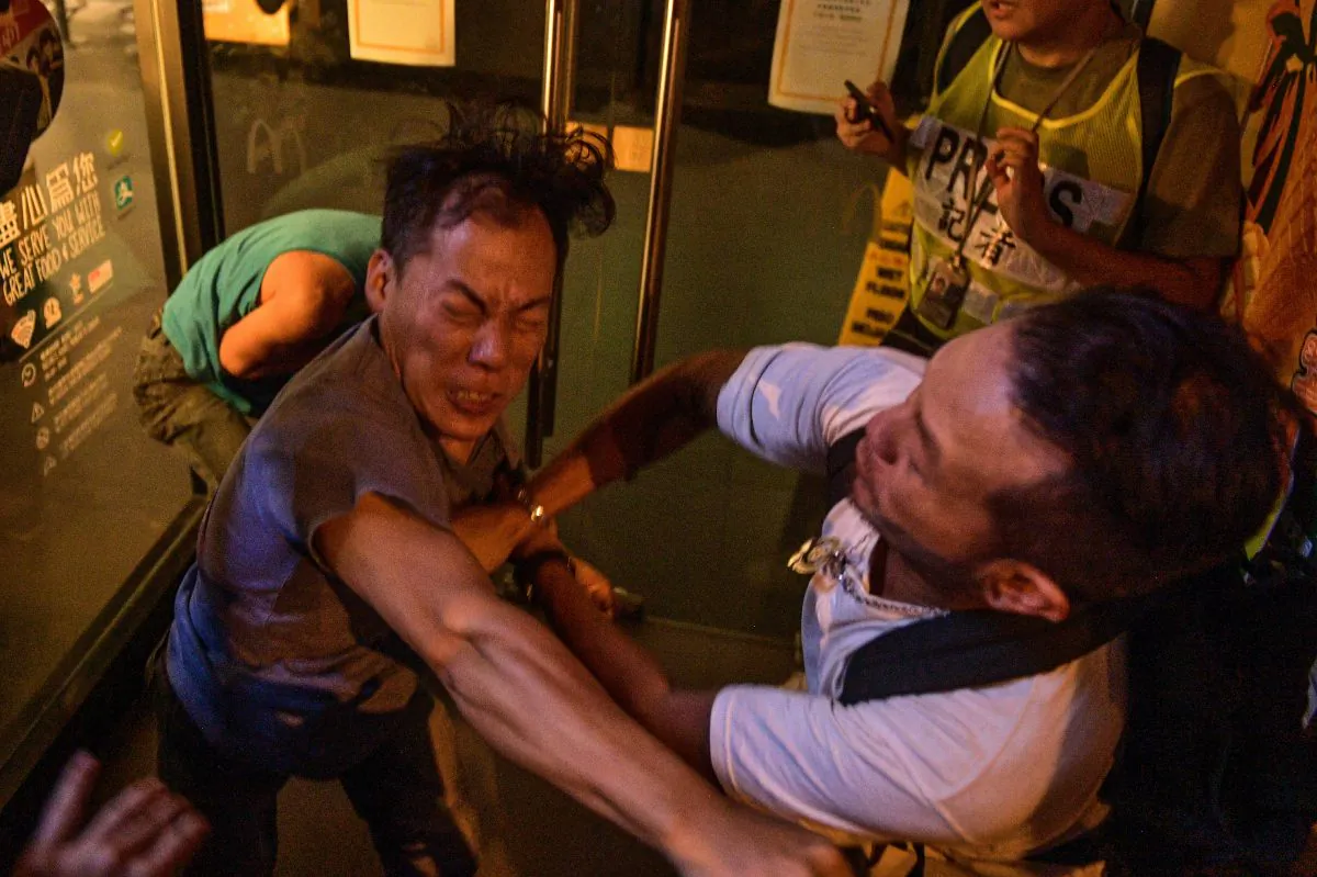 Two people broke into a fight during a protest in Hong-Kong on Sept. 15, 2019. (Nicolas Asfouri/AFP/Getty Images)