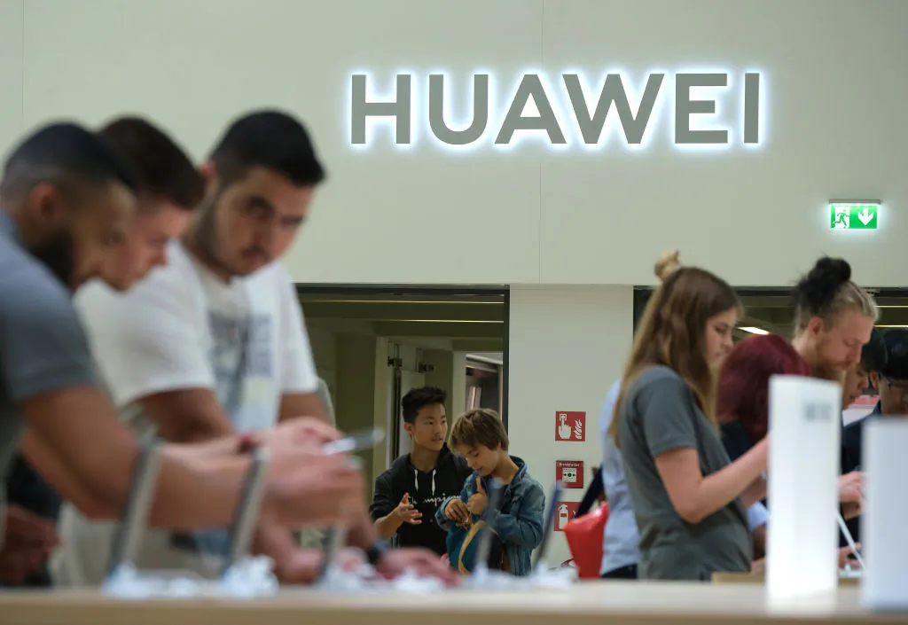Visitors check out new Huawei smartphones at the 2019 IFA home electronics and appliances trade fair in Berlin on Sept. 6, 2019. (Sean Gallup/Getty Images)