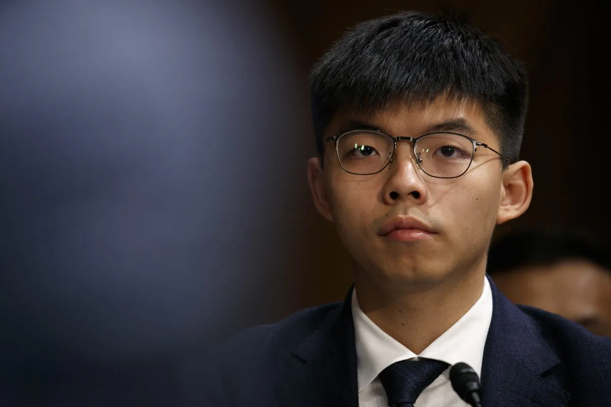 Hong Kong activist Joshua Wong, listens during a congressional hearing on the Hong Kong protests, on Sept. 17, 2019, in Washington. (AP Photo/Jacquelyn Martin)