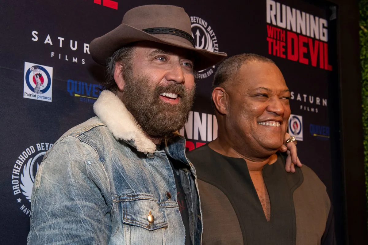 Laurence Fishburne (R) and Nicolas Cage attend the premiere of Quiver Distribution's 'Running with the Devil' at Writers Guild Theater in Beverly Hills, California on Sept. 16, 2019. (Photo by Emma McIntyre/Getty Images)