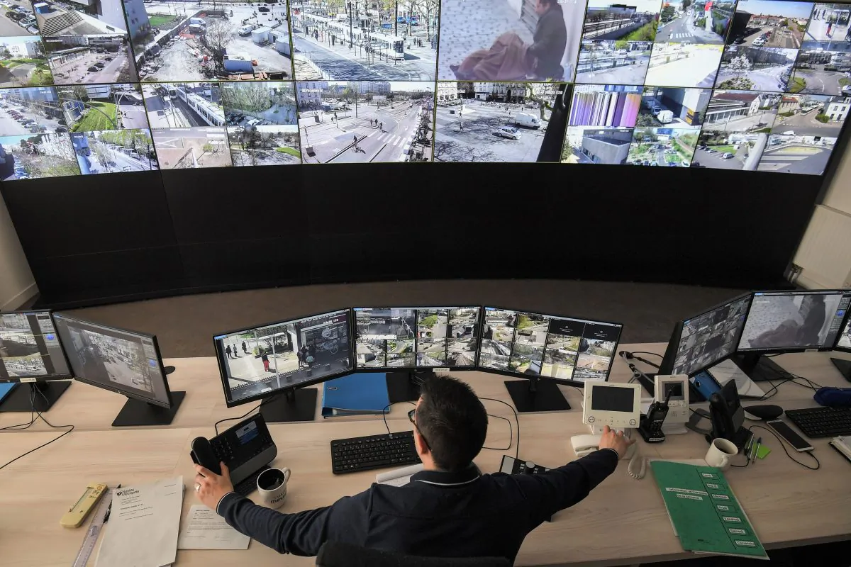 An Urban Supervision Center employee watches screens displaying CCTV (Closed-circuit television) outdoor security cameras of downtown Nantes, France on March 27, 2019. (LOIC VENANCE/AFP/Getty Images)