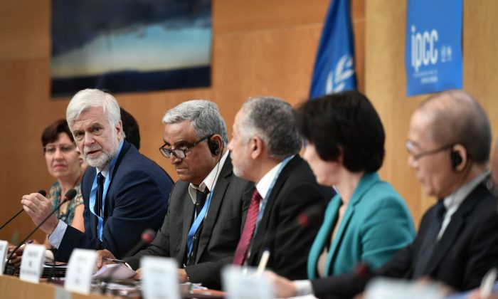 Intergovernmental Panel on Climate Change (IPCC) working group III co-chair Jim Skea (2nd L) answers a question during a press conference on a special IPCC report on climate change and land on August 8, 2019 in Geneva. - Humanity faces increasingly painful trade-offs between food security and rising temperatures within decades unless it curbs emissions and stops unsustainable farming and deforestation, a landmark climate assessment said the IPCC. Negotiators from 195 countries on August 8, 2019 finalised the most comprehensive scientific assessment yet of how the land we live off affects climate change, after marathon talks in Geneva. (Photo by FABRICE COFFRINI / AFP) (Photo credit should read FABRICE COFFRINI/AFP/Getty Images)