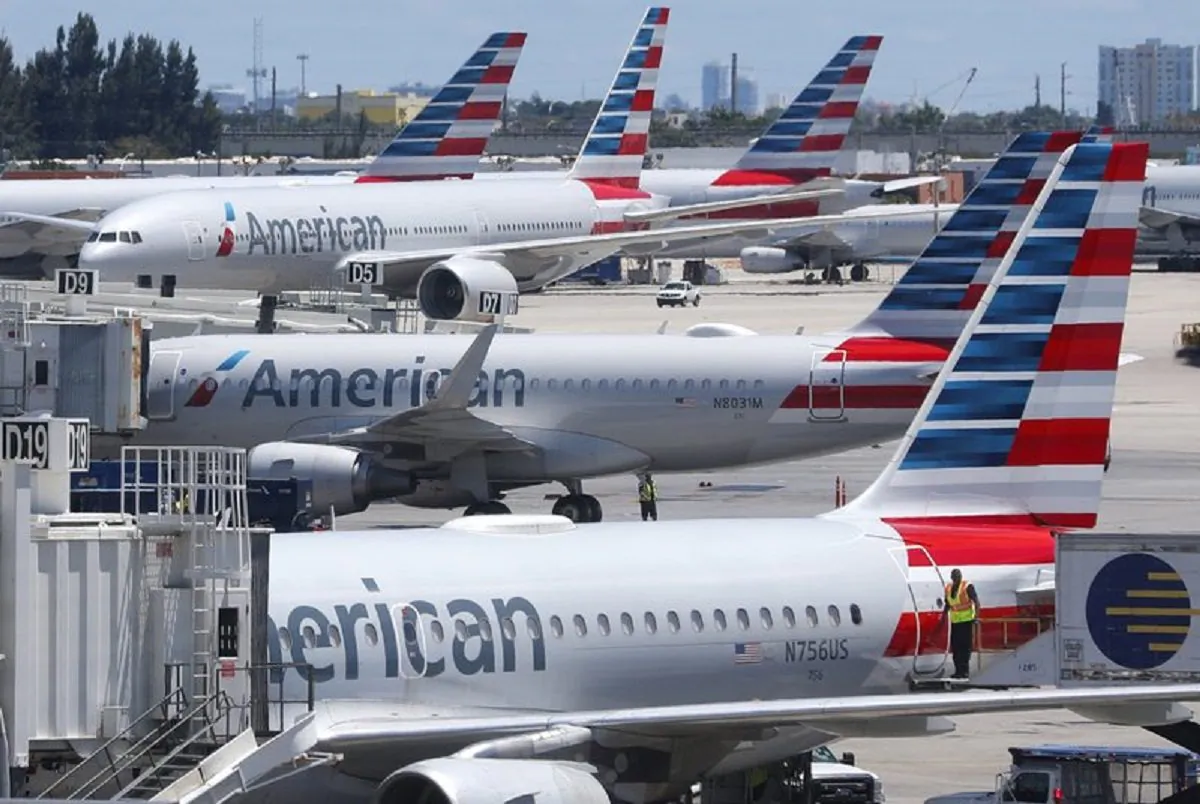  In this April 24, 2019, photo, American Airlines aircraft are shown parked at their gates at Miami International Airport in Miami. (AP Photo/Wilfredo Lee, File)