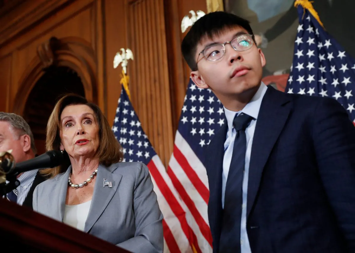 House Speaker Nancy Pelosi (L) with Hong Kong activist Joshua Wong and other members of Congress during a news conference on human right in Hong Kong in Washington, on Sept. 18, 2019. (Pablo Martinez Monsivais/AP Photo)