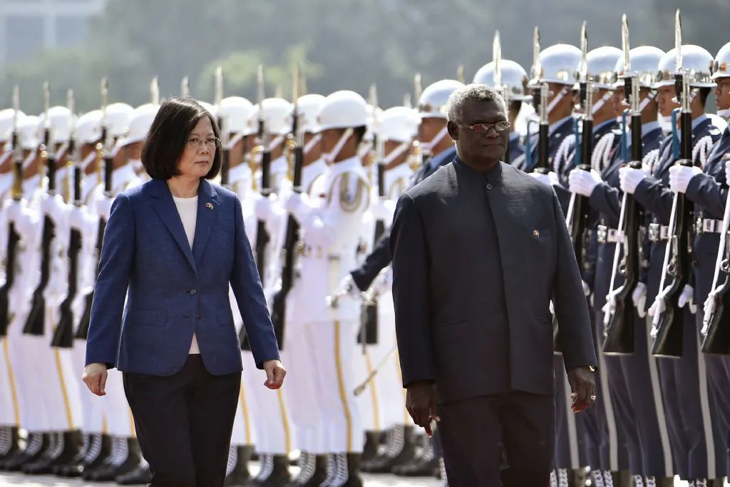 Solomon Islands President Manasseh Sogavare (R) and Taiwan President Tsai Ing-wen (L) inspect an honor guard during a welcome ceremony in Taipei on Sept. 26, 2017. (Sam Yeh/AFP/Getty Images)