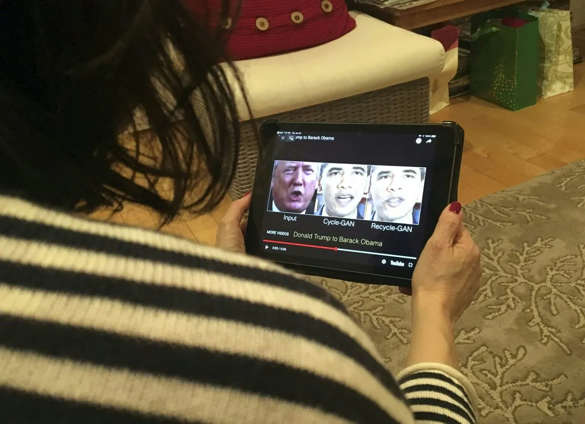 A woman in Washington, DC, views a manipulated video on Jan. 24, 2019. (Rob Lever/AFP/Getty Images)
