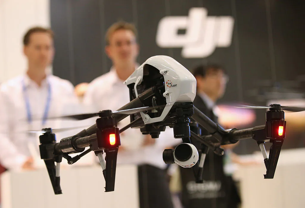 DJI Inspire 1 quadcopter drone flies at the DJI stand at the 2015 IFA consumer electronics and appliances trade fair in Berlin, Germany, on Sept. 4, 2015. (Sean Gallup/Getty Images)