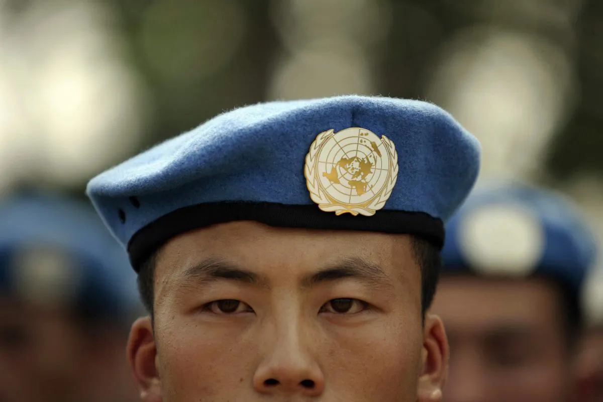 People's Liberation Army (PLA) soldiers deployed for United Nations (UN) peace keeping missions line up at their base in China's central Henan province before being sent to Africa on Sept. 15, 2007. (PETER PARKS/AFP/Getty Images)