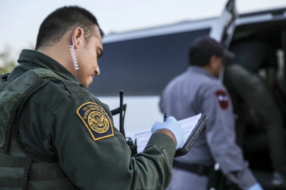 Border Patrol agents apprehend illegal immigrants who have just crossed the Rio Grande from Mexico into the United States near McAllen, Texas, on April 18, 2019. (Charlotte Cuthbertson/The Epoch Times)