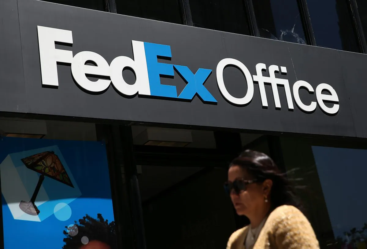 A pedestrian walks by a FedEx Office store in San Francisco, California, U.S. on June 19, 2003. (Justin Sullivan/Getty Images)