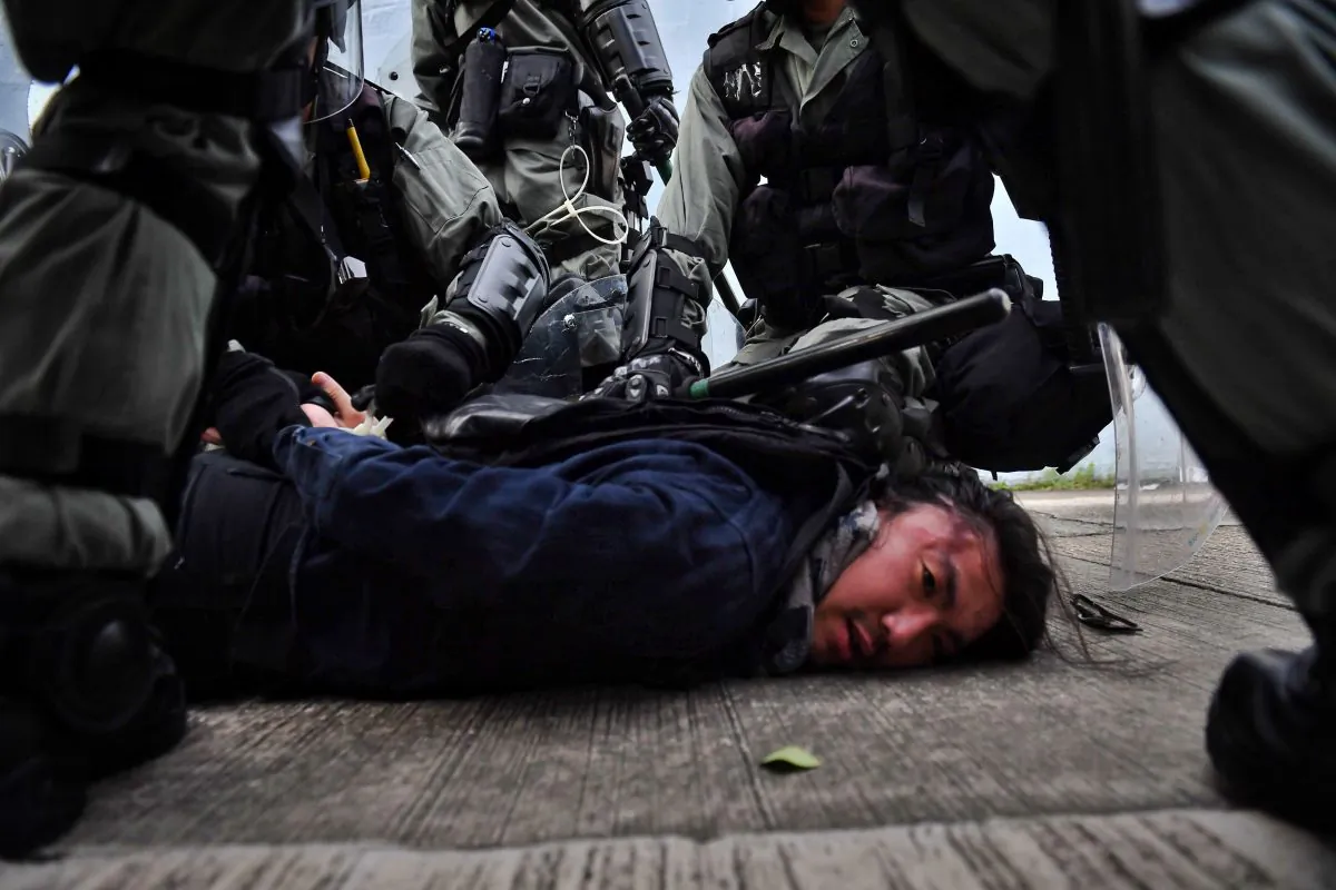 Riot police detain a protester at Kowloon Bay in Hong Kong on Aug. 24, 2019. (Lillian Suwanrumpha/AFP/Getty Images)