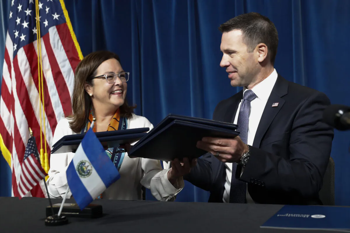 Acting Secretary of Homeland Security Kevin K. McAleenan with Alexandra Hill, Minister of Foreign Affairs for El Salvador, after signing an agreement during news conference at the US Customs and Border Protection Headquarters in Washington, on Sept. 20, 2019. (Pablo Martinez Monsivais/AP Photo)