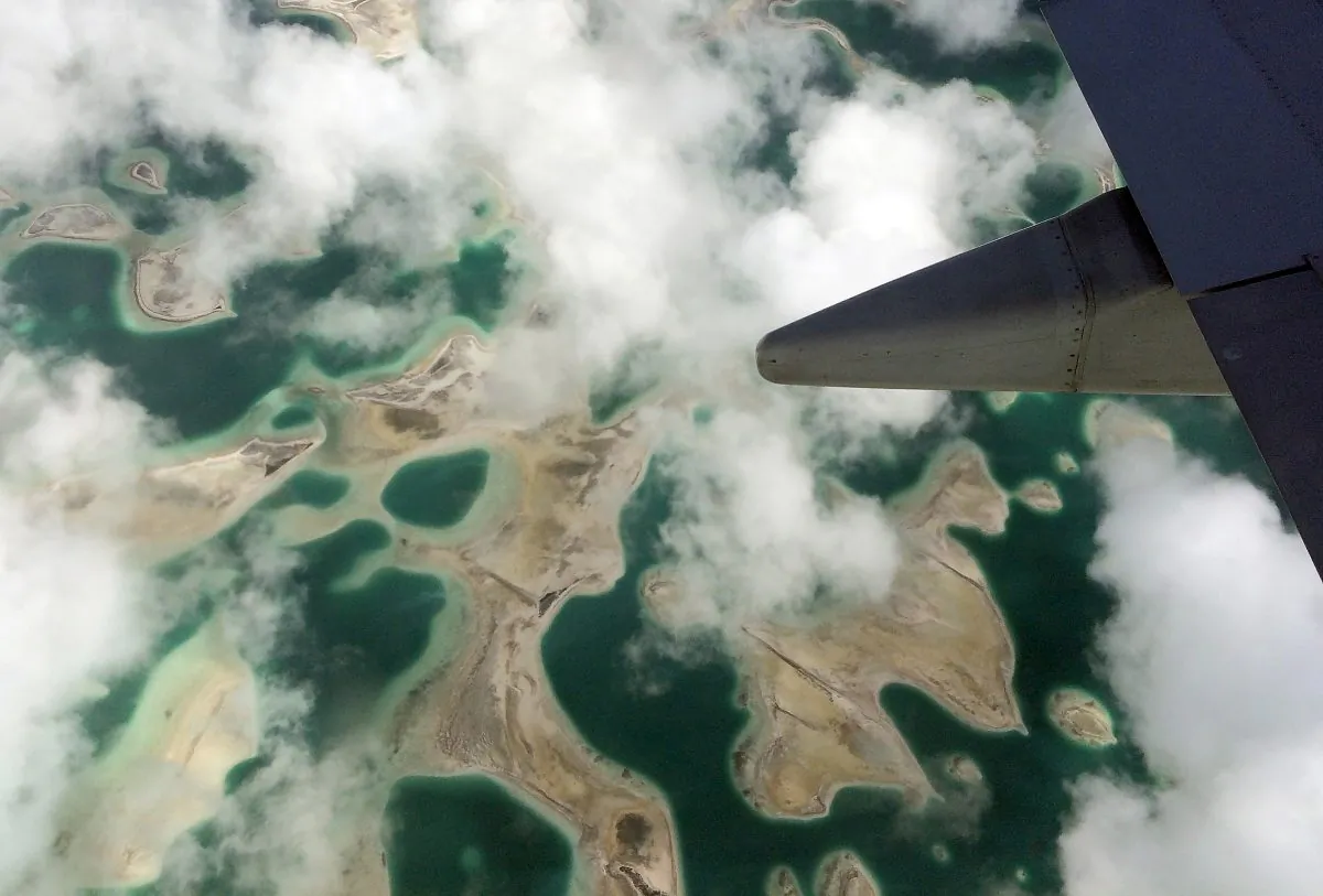 Lagoons can be seen from a plane as it flies above Kiritimati Island, part of the Pacific Island nation of Kiribati, April 5, 2016. (Lincoln Feast/Reuters)