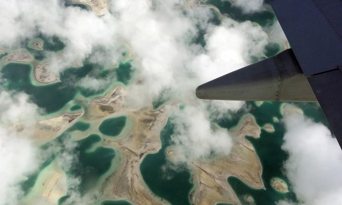 Lagoons can be seen from a plane as it flies above Kiritimati Island, part of the Pacific Island nation of Kiribati, April 5, 2016. (Lincoln Feast/Reuters)