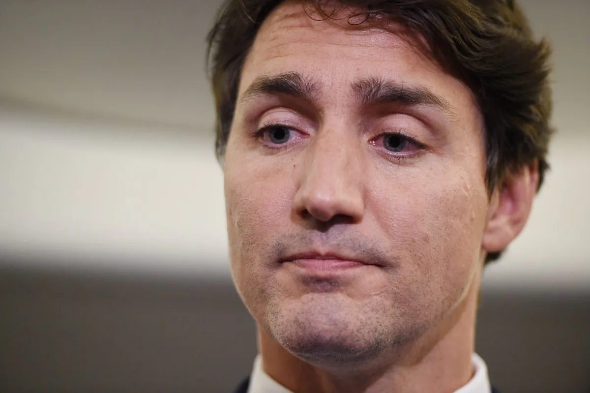 Liberal Leader Justin Trudeau reacts as he makes a statement in regards to photo coming to light of himself from 2001 wearing "brownface" during a scrum on his campaign plane in Halifax, N.S., on Sept. 18, 2019. (THE CANADIAN PRESS/Sean Kilpatrick)