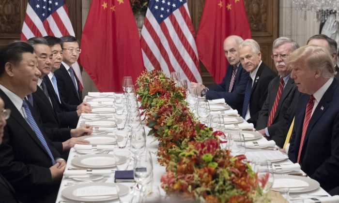 U.S. President Donald Trump (R) and China's President Xi Jinping (L) along with members of their delegations, hold a dinner meeting at the end of the G20 Leaders' Summit in Buenos Aires, on December 01, 2018. - US President Donald Trump and his Chinese counterpart Xi Jinping had the future of their trade dispute -- and broader rivalry between the world's two top economies -- on the menu at a high-stakes dinner Saturday. (Saul Loeb/AFP/Getty Images)