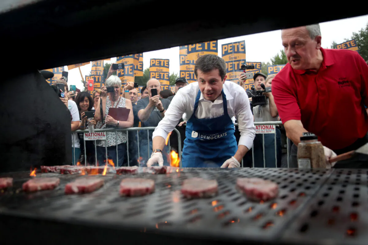 Democratic presidential candidate and South Bend, Indiana mayor Pete Buttigieg works the grill at the Polk County Democrats' Steak Fry in Des Moines, Iowa, on Sept. 21, 2019. (Scott Olson/Getty Images)