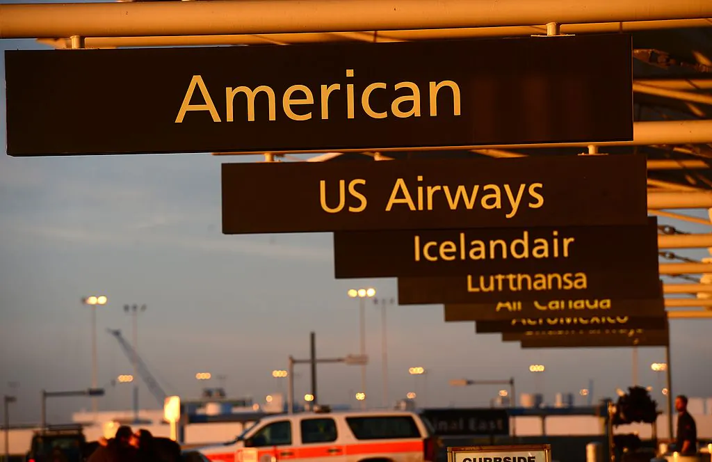 American Airlines sign at Denver International Airport in Denver, Colo., Dec. 9, 2013. (Emmanuel  Dunand/AFP/Getty Images)
