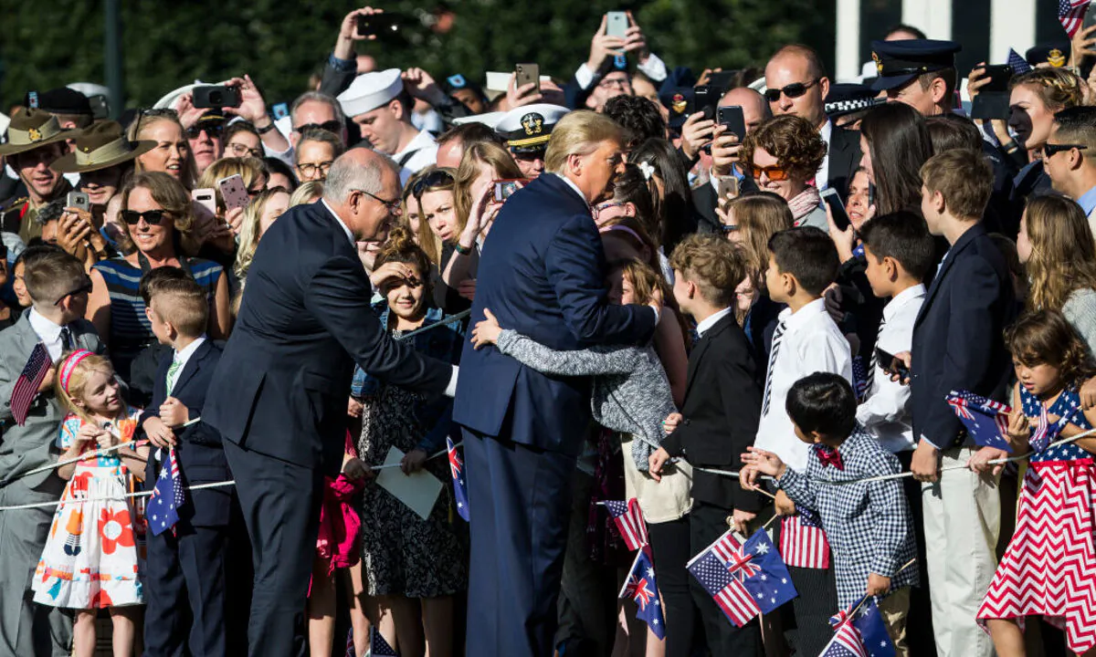 President Donald Trump and Australian Prime Minister Scott Morrison greet members of the audience during an official visit ceremony at the South Lawn of the White House, Washington, on Sep. 20, 2019. (Zach Gibson/Getty Images)
