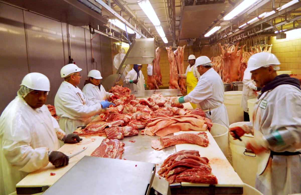 Workers cut pork at a slaughterhouse in Chicago, Illinois, on July 18, 2015. (Karl Plume/Reuters)