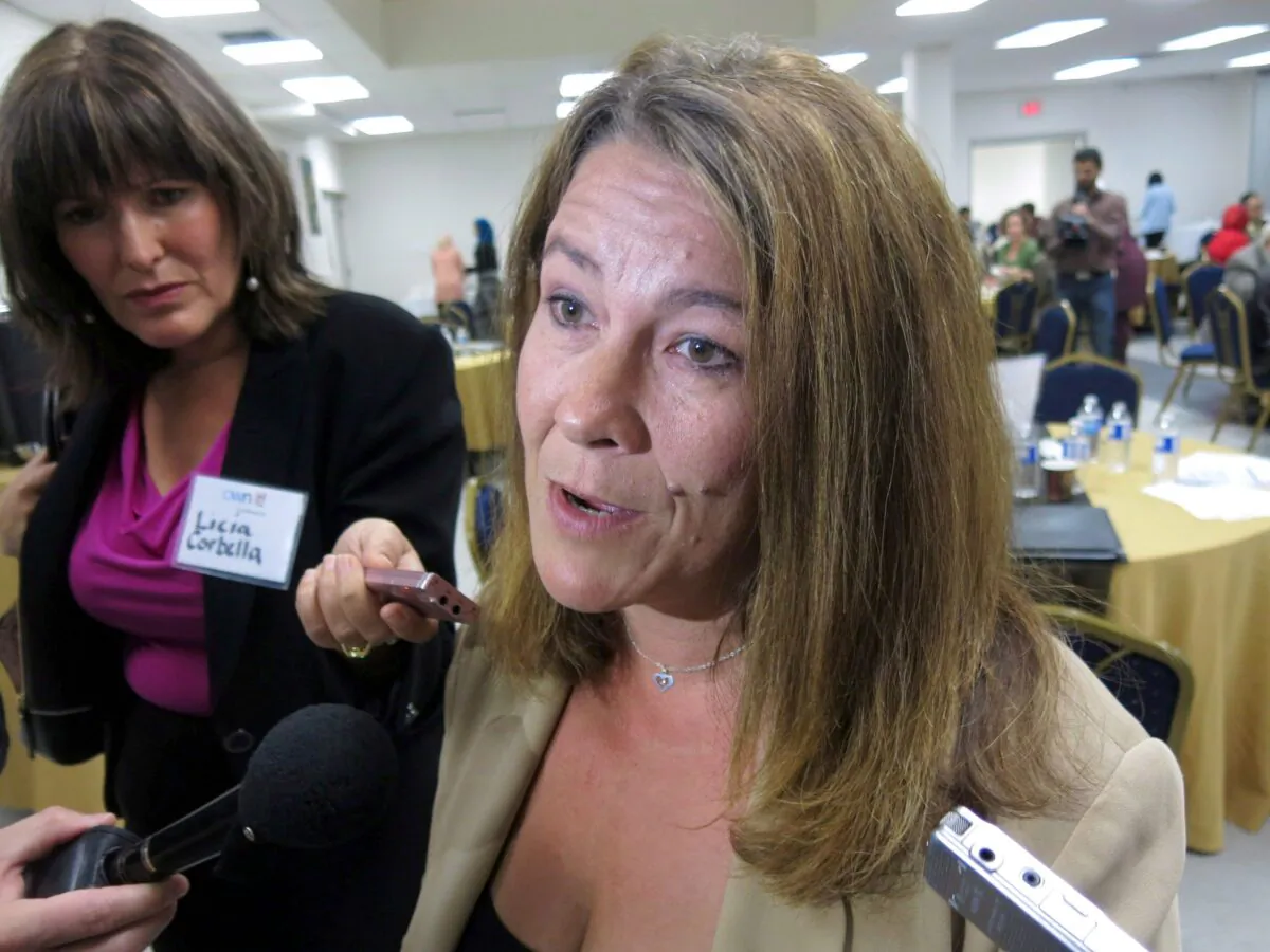 Chris Boudreau, whose son converted to Islam and died fighting in Syria, speaks to reporters on Sept. 11, 2014, at a conference on how to prevent the radicalization of Muslim youth. She believes a Calgary program that links at-risk young people with police officers and social workers to steer them away from dangerous ideologies should be mandatory. (The Canadian Press/Bill Graveland)