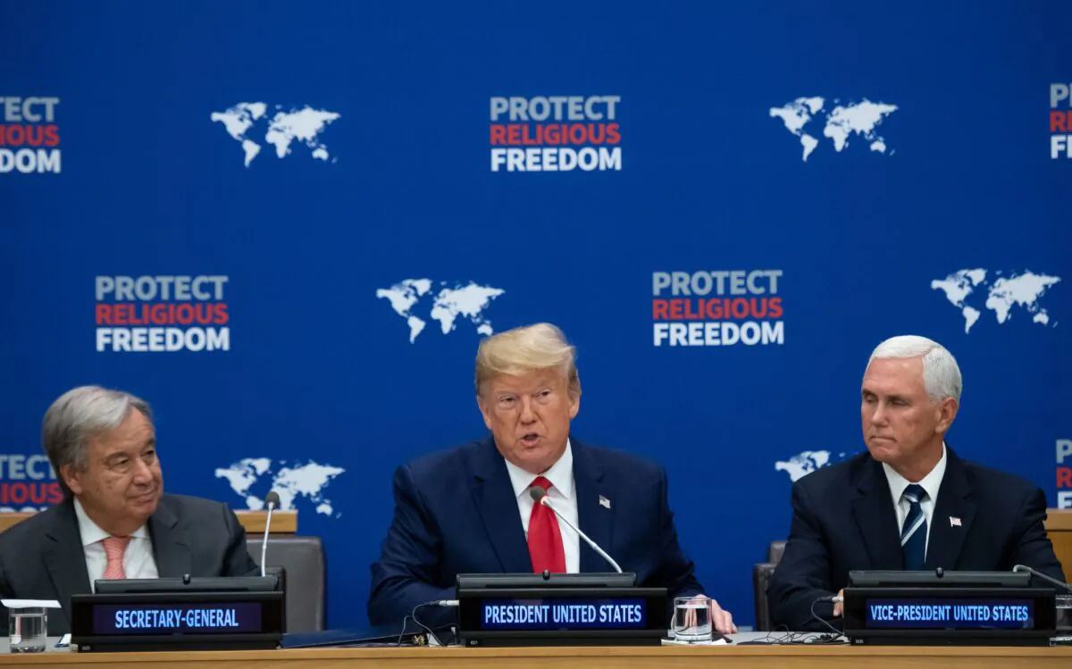 US President Donald Trump (C) speaks alongside US Vice President Mike Pence (R) and UN Secretary General Antonio Guterres (L) at a United Nations event on Religious Freedom at UN Headquarters in New York, Sept. 23, 2019. (SAUL LOEB/AFP/Getty Images)