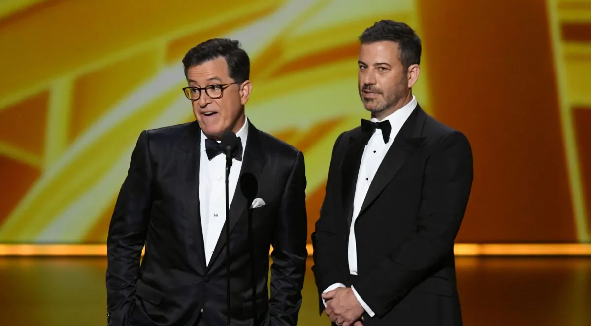 Stephen Colbert and Jimmy Kimmel speak onstage during the 71st Emmy Awards at Microsoft Theater in Los Angeles, California on Sept. 22, 2019. (Photo by Kevin Winter/Getty Images)