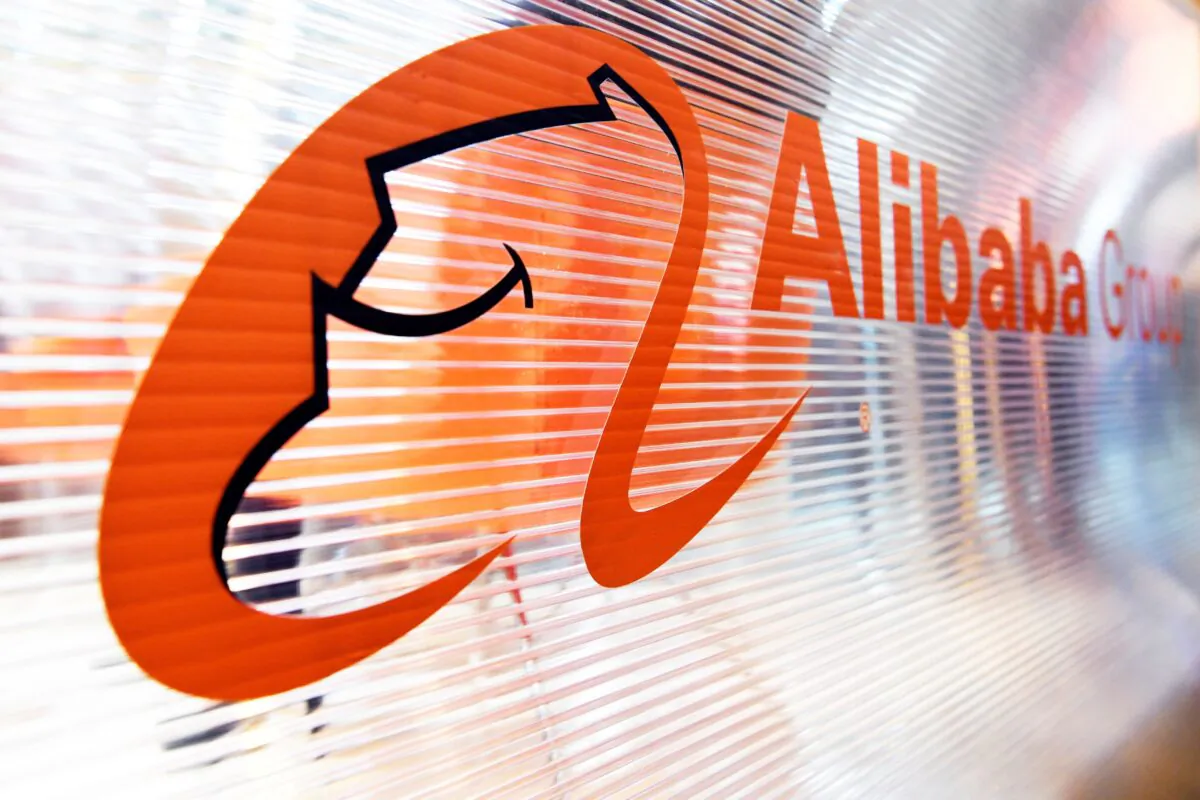 A logo of the Chinese multinational e-commerce, retail, internet, and technology conglomerate, Alibaba group, is pictured on a window of a stand during the Vivatec trade fair (Viva Technology) in Paris, France, on May 24, 2018. (Alain Jocard/AFP/Getty Images)