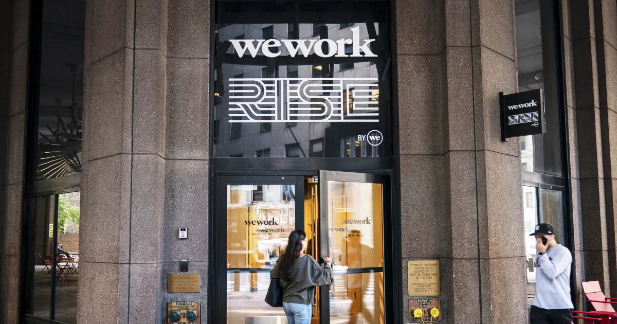 A woman enters a WeWork office facility stands in the Financial District in New York City on Sept. 13, 2019. (Drew Angerer/Getty Images)