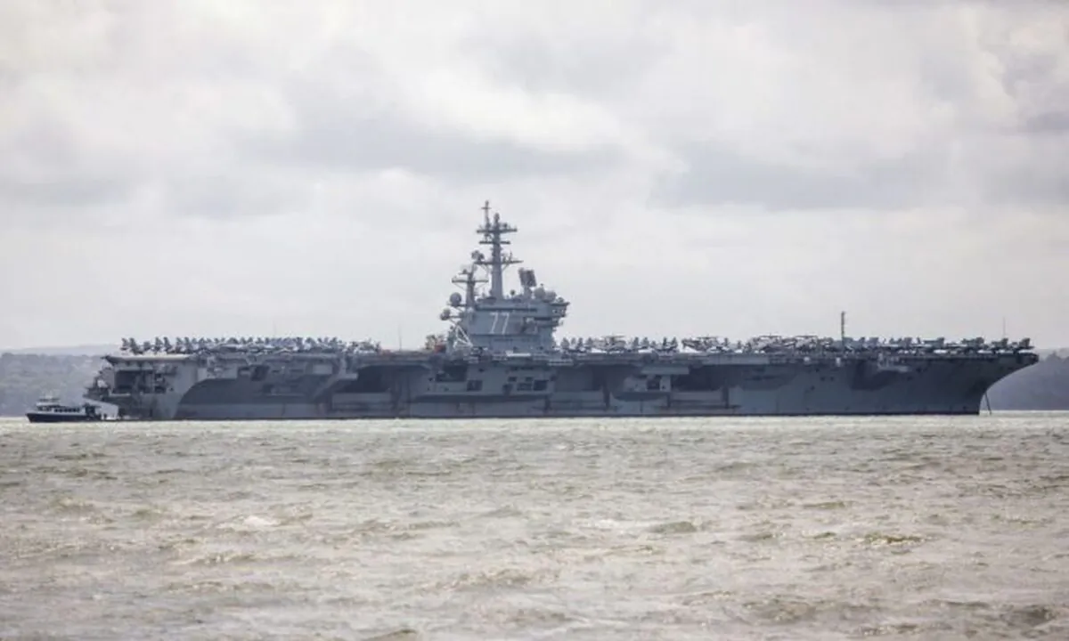 US Navy Nimitz-class aircraft carrier USS George H.W. Bush is pictured anchored off the coast in Portsmouth, England, on July 27, 2017. (Photo by Jack Taylor/Getty Images)