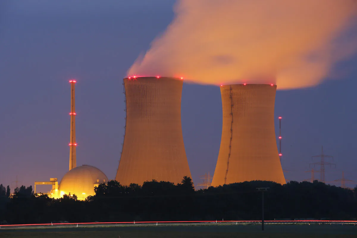 Steam rises from the cooling towers of the Grafenrheinfeld nuclear power plant at night near Grafenrheinfeld, Germany, on June 11, 2015. (Sean Gallup/Getty Images)