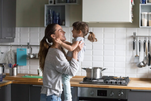 mother holding cute little child daughter