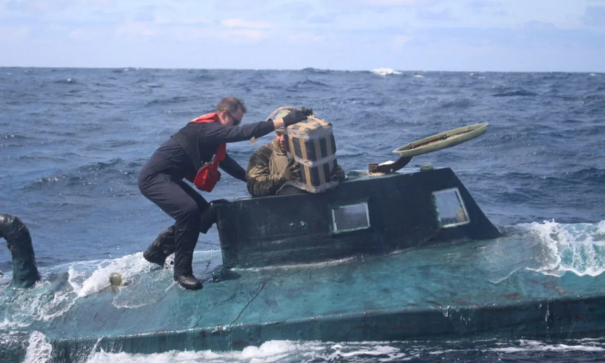 Crews intercepted a drug-laden, 40-foot self-propelled semi-submersible (SPSS) in the Eastern Pacific carrying approximately 12,000 pounds of cocaine, worth over $165 million and apprehended four suspected drug smugglers. (U.S. Coast Guard Photo)