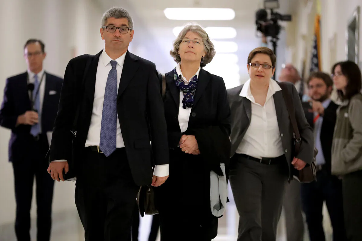 Fusion GPS contractor Nellie Ohr (C) arrives for a closed-door interview with investigators from the House Judiciary and Oversight committees in the Rayburn House Office Building on Capitol Hill October 19, 2018 in Washington, DC. Chip Somodevilla/Getty Images