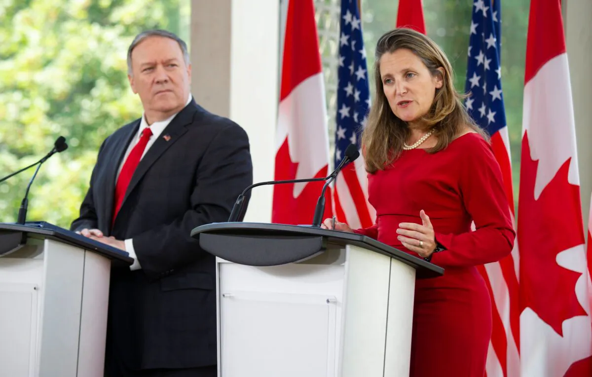 U.S. Secretary of State Mike Pompeo listens to Canadian Foreign Minister Chrystia Freeland speak during a joint press conference in Ottawa on Aug. 22, 2019. (Sebastien St-Jean/AFP/Getty Images)
